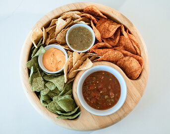 Wooden Platter with Tortilla Chips Salsa and Dipping Sauces at Memory Care Facility Wooden Platter with Tortilla Chips Salsa and Dipping Sauces at Memory Care Facility