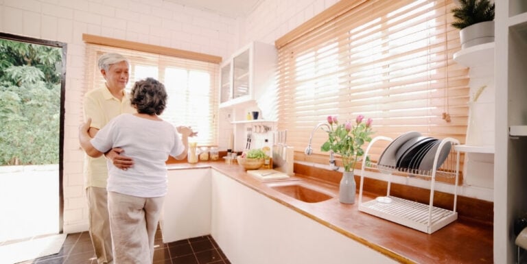 Elderly Couple Dancing Together in Their Private Kitchenette at Assisted Living Facility